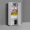 An open white cabinet filled with various items such as cleaning supplies, buckets, boots, and containers. Voir les images du produit