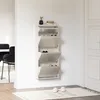 A wall-mounted shoe cabinet with four flip-down compartments, shown in a hallway or entryway setting. Voir les images du produit