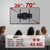 A TV wall mount is shown mounted on a wall above a group of people sitting on a couch, with a table overlay showing VESA compatibility and weight capacity. Anteprima dell’immagine prodotto