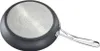 The underside of a black frying pan with a silver, textured bottom and a silver handle. Voir les images du produit