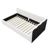 A white and black daybed with a slatted base, shown from a diagonal angle against a white background. Náhľad obrázku produktu
