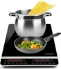 An induction cooktop with a pot of spaghetti and a frying pan with vegetables. Voir les images du produit