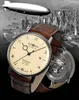 A watch is shown in the foreground with a vintage city skyline and a zeppelin in the background. Produktbild-Vorschau