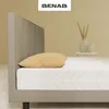 A close-up side view of a mattress on a bed frame, with a pillow on top. Náhľad obrázku produktu