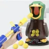 A person is holding a toy gun and aiming it at a duck-shaped target. Náhled obrázku produktu