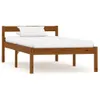A wooden bed frame with a white mattress and pillow, isolated on a white background. Podgląd zdjęcia produktu
