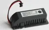 A close-up studio shot of a black PLC battery pack with a red and black wire connector. Náhled obrázku produktu