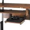 A close-up view of a gaming desk with a shelf holding a game console and controller. Náhled obrázku produktu