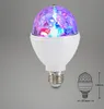 A disco ball light bulb with a white base and a faceted, multi-colored crystal-like top, shown against a plain gray background. A small diagram of the bulb with dimensions is also present. Produktbild-Vorschau