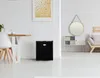 A modern living room with a dining area and a small black refrigerator. Náhľad obrázku produktu