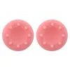 Two pink silicone controller thumb grips with raised dots. Produktbild-Vorschau