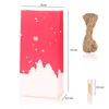 A red paper bag with a snowy forest design, along with a bundle of jute twine and a wooden clothespin, all with dimension labels. Produktbild-Vorschau