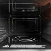 Interior view of a microwave oven, showing the turntable and the inner walls. Produktbild-Vorschau