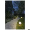 A pathway illuminated by spherical outdoor lights leads to a house at dusk. Produktbild-Vorschau