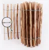 A close-up view of a wooden garden fence made of natural hazelnut branches, bound together with wire. Produktbild-Vorschau