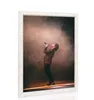 A framed picture of a singer performing on stage with smoke and spotlights. Produktbild-Vorschau