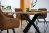 A dining table with chairs in a room setting. Produktbild-Vorschau