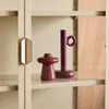 Two decorative objects on a shelf inside a cabinet. Produktbild-Vorschau