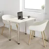 A small dining table with two chairs in a bright, minimalist room. Náhľad obrázku produktu