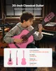 A young person playing a pink classical guitar in a room with musical instruments. Anteprima dell’immagine prodotto