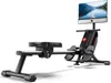 A rowing machine with a large screen displaying a scenic view. Produktbild-Vorschau