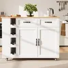 A white kitchen island with a wooden countertop, featuring drawers, cabinets, and a wine rack, set in a kitchen environment. Podgląd zdjęcia produktu