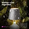 A lamp is shown outdoors in the rain, highlighting its weather resistance. Anteprima dell’immagine prodotto