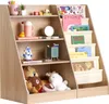 A wooden children's bookshelf filled with books and stuffed animals.