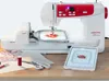 A sewing and embroidery machine is displayed on a wooden table with various sewing accessories. Produktbild-Vorschau