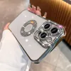 A person's hand is holding a white iPhone 13 Pro Max with a silver, diamond-encrusted case. Produktbild-Vorschau