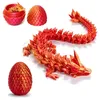 A 3D printed dragon and its egg are displayed on a white background. Produktbild-Vorschau