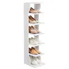 A white, multi-tiered shoe rack with several pairs of shoes displayed on its shelves. Náhled obrázku produktu