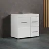 A white high-gloss vanity cabinet with drawers and a door is shown against a textured dark gray wall and a wooden slatted wall. Podgląd zdjęcia produktu