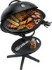 A black electric grill with food on it, placed on a stand with a small shelf. Podgląd zdjęcia produktu