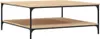 A square coffee table with two shelves, made of wood-effect material and a black metal frame. Produktbild-Vorschau