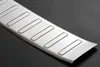 A close-up, angled shot of a brushed metal car bumper protector with raised rectangular ridges. Anteprima dell’immagine prodotto
