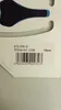 A close-up view of a bicycle saddle and its packaging label. Produktbild-Vorschau