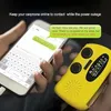 A person is holding a smartphone and a yellow emergency radio. The phone displays a text message conversation. Produktbild-Vorschau