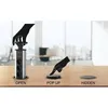 A pop-up power strip is shown in three states: open, being popped up, and hidden, on a wooden desk in an office setting. Produktbild-Vorschau