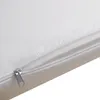 A close-up view of a white mattress with a partially unzipped cover, revealing the foam interior. Produktbild-Vorschau