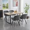 A dining set with four chairs and a table in a well-lit room. Produktbild-Vorschau