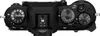 Top view of a black Fujifilm camera body, showing various dials and buttons. Voir les images du produit