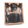 A black router and its power adapter are shown inside a cardboard packaging tray. Anteprima dell’immagine prodotto