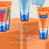 Several tubes of fabric paint are displayed on orange geometric blocks, with some paint dripping from one tube. Produktbild-Vorschau
