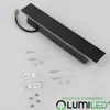A black outdoor wall light with its installation accessories laid out on a light gray surface. Náhľad obrázku produktu