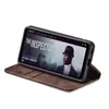 A smartphone in a brown flip case is displayed on a white background, showing a movie poster on the screen. Produktbild-Vorschau