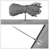 Close-up views of a rolled-up gray rope and a grommet on a gray fabric. Produktbild-Vorschau