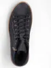A top-down view of a black high-top sneaker with a brown sole. Produktbild-Vorschau