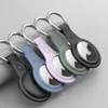 A row of five Apple AirTag holders in different colors, each with a metal ring attached. Produktbild-Vorschau