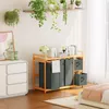A bedroom or laundry room setting with a laundry sorter and other furniture. Voir les images du produit